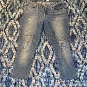 Levi’s cropped distressed light blue skinny jeans